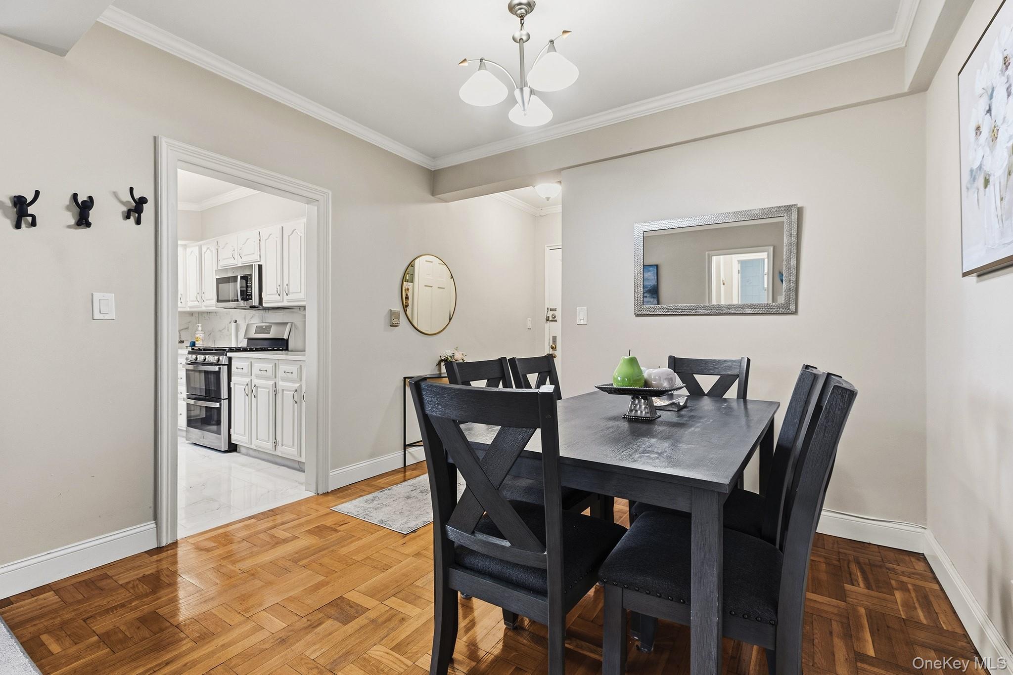 210 Pelham Road, Unit 6E New Rochelle, NY 10805 - Photo 4 of 15 a view of a dining room with furniture