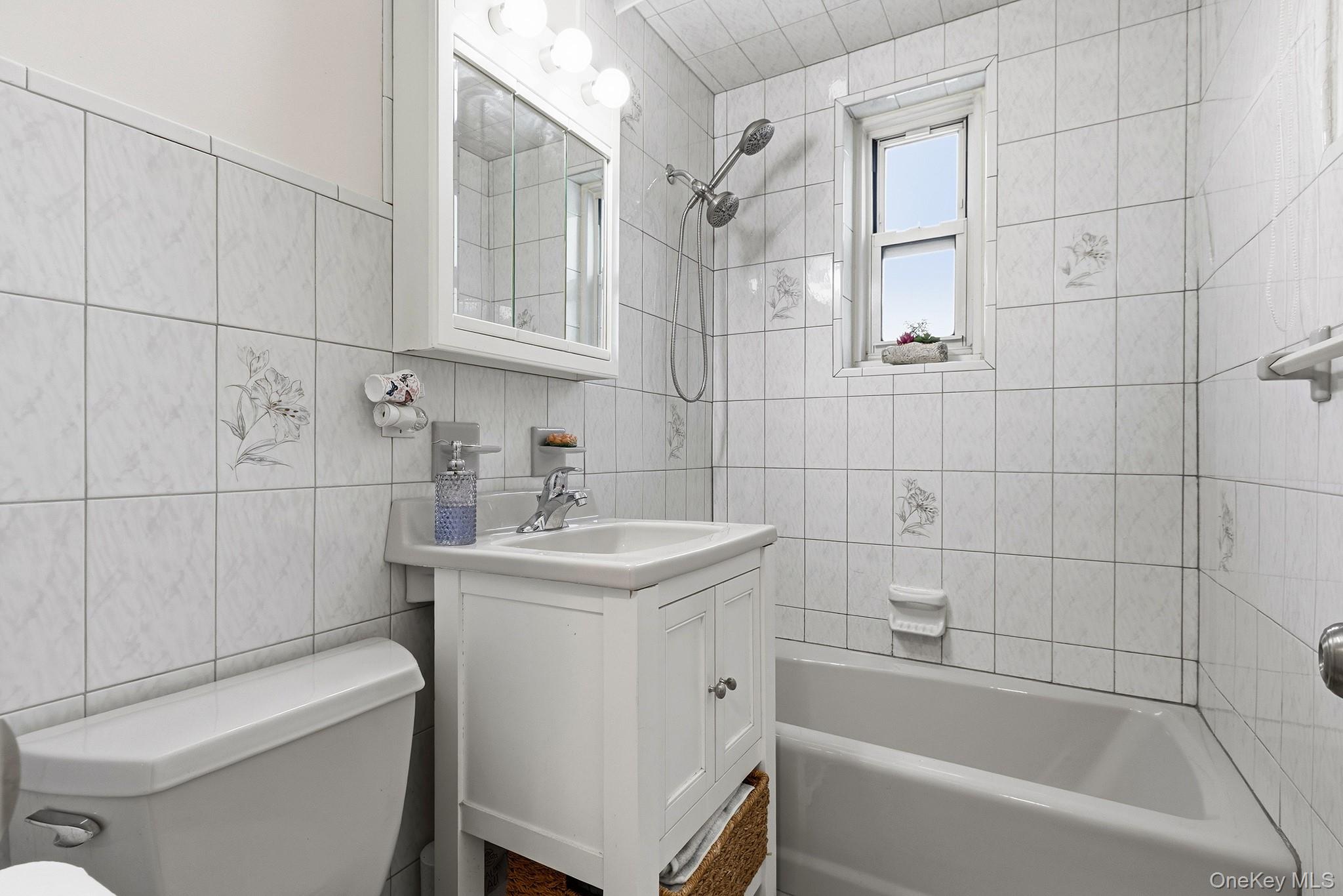 210 Pelham Road, Unit 6E New Rochelle, NY 10805 - Photo 9 of 15 a bathroom with a sink toilet and shower