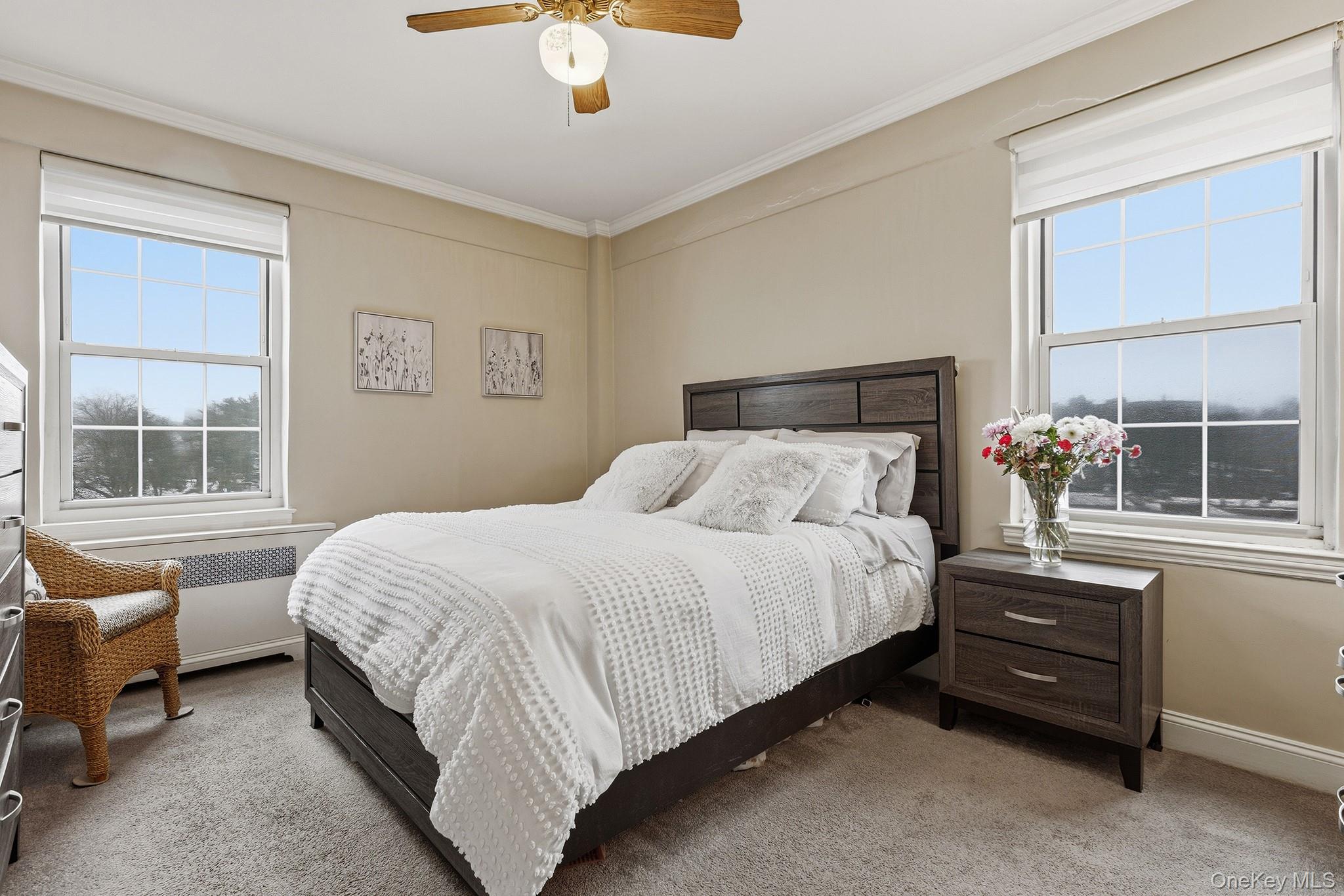 210 Pelham Road, Unit 6E New Rochelle, NY 10805 - Photo 10 of 15 a bedroom with a bed and window