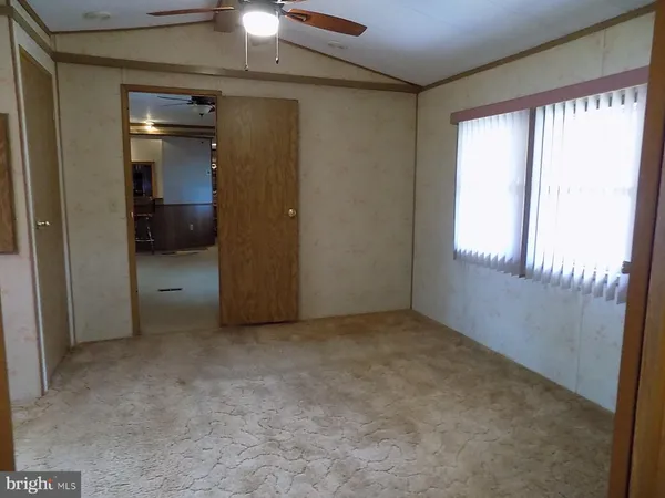 a view of a hallway with a sink and a window