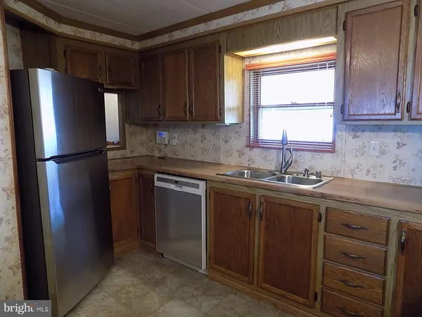 a kitchen with a stove and a microwave