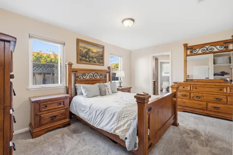 a bedroom with a bed and a table