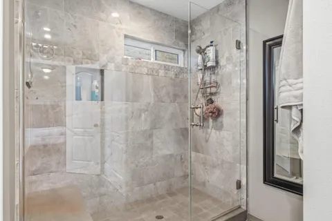a living room with furniture a rug and a window