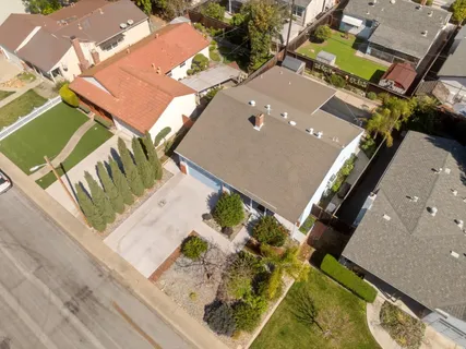 an aerial view of a house with a ocean view
