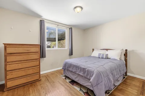 a bathroom with a shower a toilet and a sink
