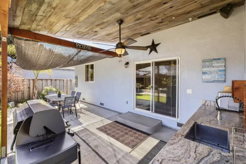 a view of a chairs and table in the patio
