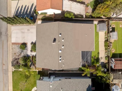 an aerial view of a house with a swimming pool