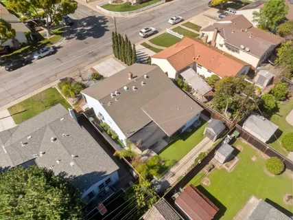 front view of a house with a flower garden
