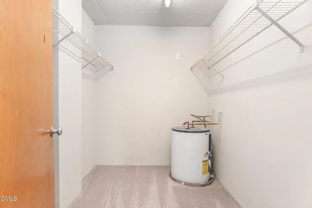 a view of a storage & utility room with racks on the wall