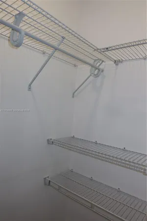 a view of a room with racks on the wall