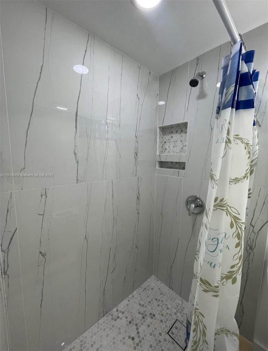 22905 Southwest 114th Place Miami, FL 33170 - Photo 2 of 6 a bathroom with a shower and a sink