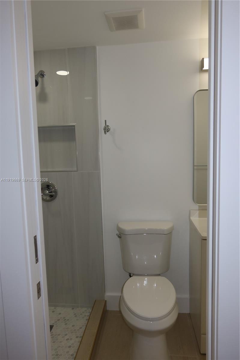 22905 Southwest 114th Place Miami, FL 33170 - Photo 4 of 12 a white toilet sitting next to a shower