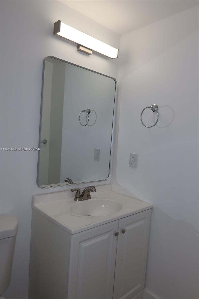 22905 Southwest 114th Place Miami, FL 33170 - Photo 5 of 12 a bathroom with a sink and mirror