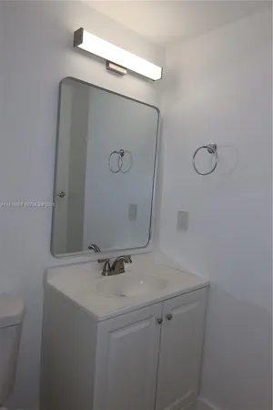a bathroom with a sink and mirror