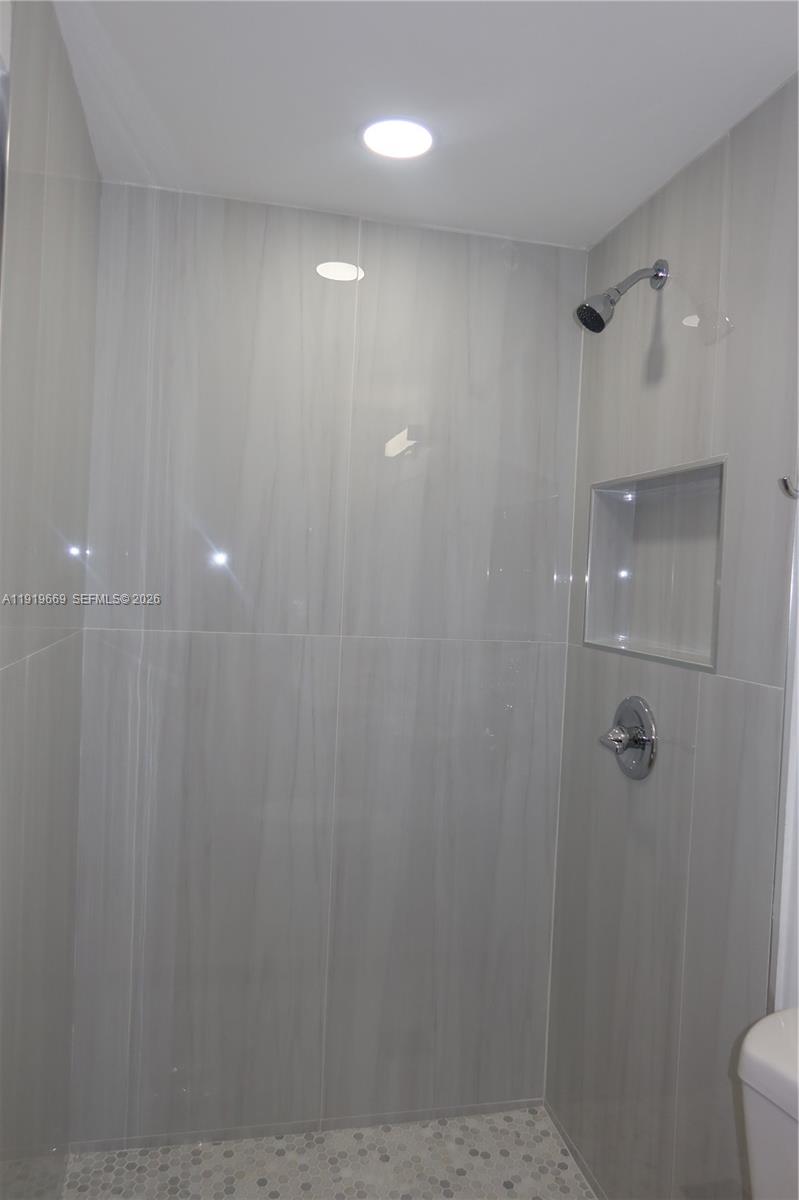 22905 Southwest 114th Place Miami, FL 33170 - Photo 6 of 12 a bathroom with a shower