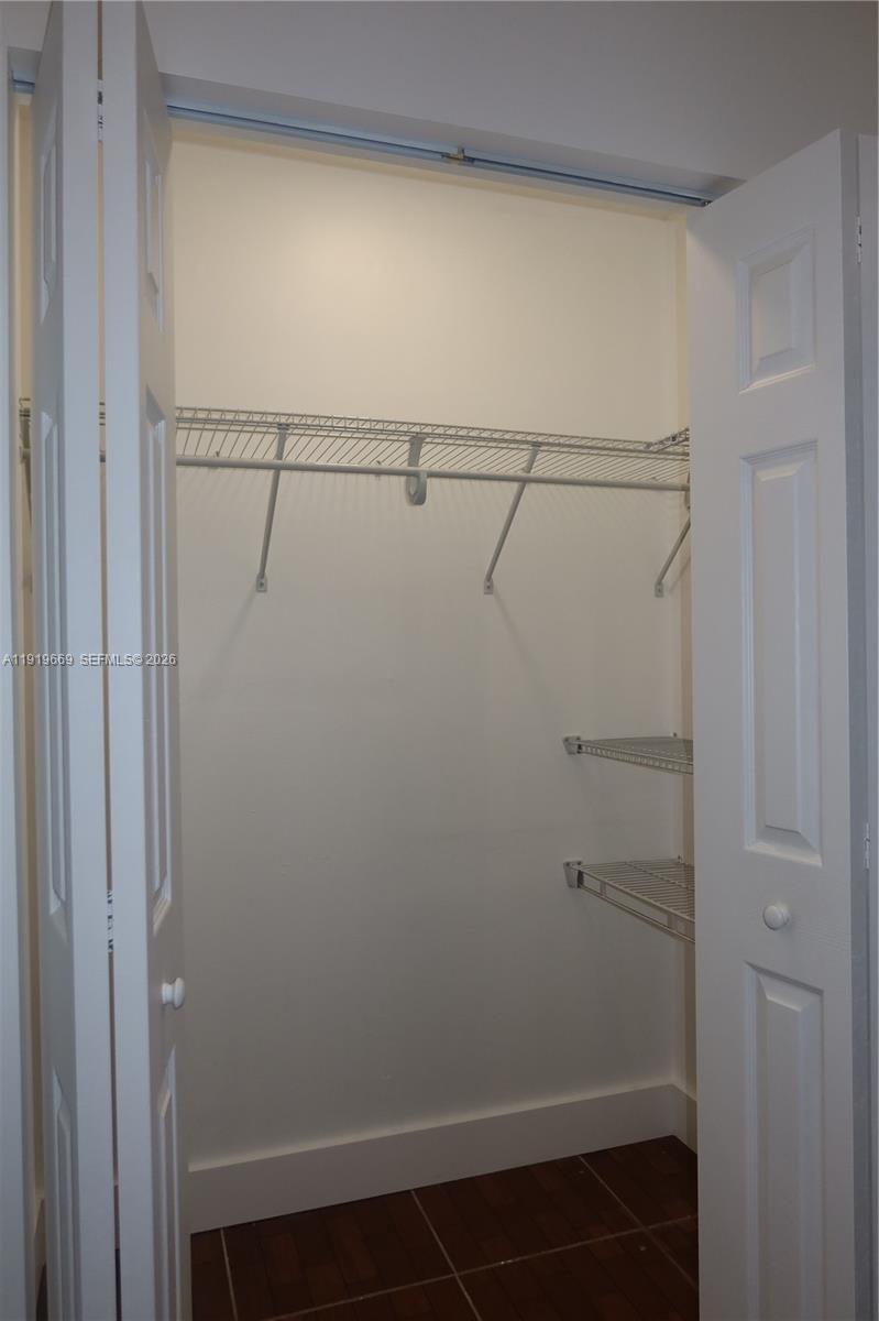 22905 Southwest 114th Place Miami, FL 33170 - Photo 9 of 12 a view of small space with racks on the wall