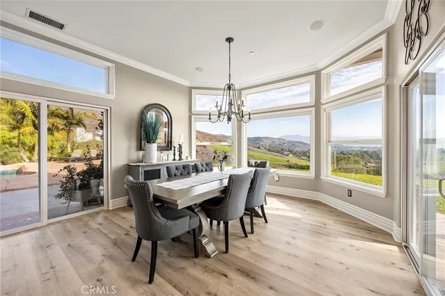 a living room with furniture large window and a fireplace