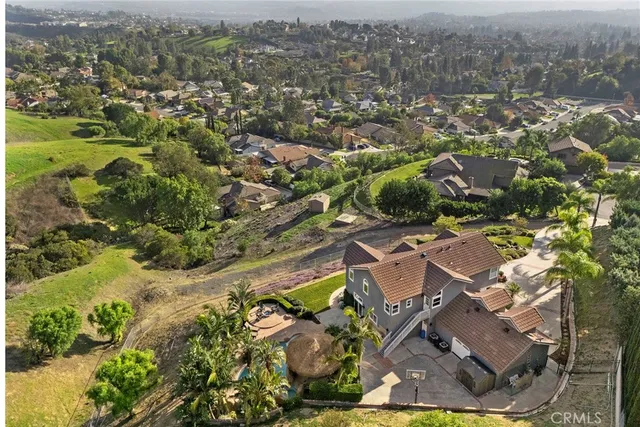 an aerial view of residential house with parking space