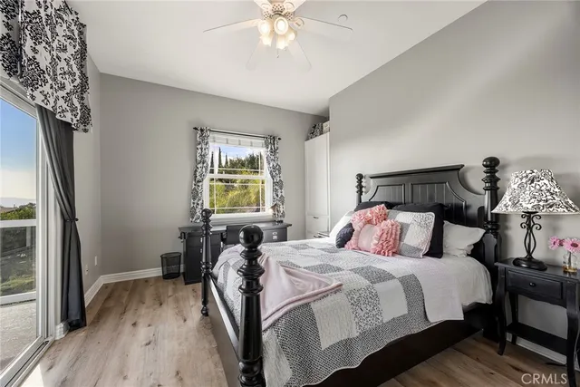 a bathroom with a granite countertop sink mirror toilet and shower