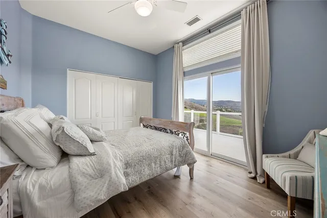a bathroom with a granite countertop sink mirror and a bathtub