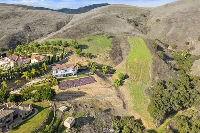 a living room with furniture a flat screen tv and a large window