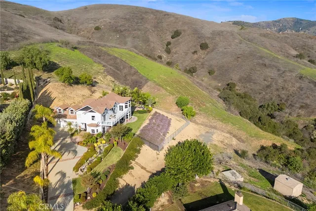a large kitchen with stainless steel appliances kitchen island granite countertop a large counter top and sink