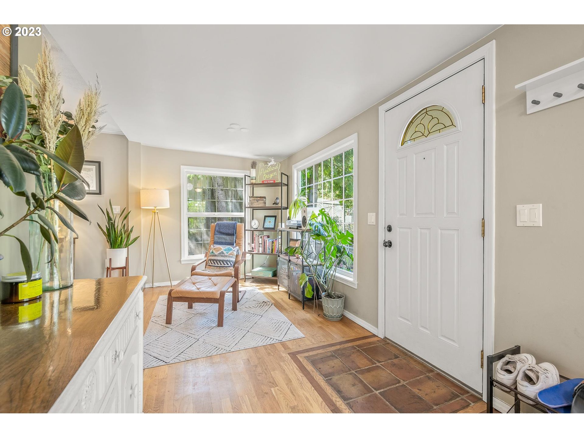 4052 Southwest Huber Street Portland, OR 97219 - Photo 11 of 48 a living room with furniture and a potted plant