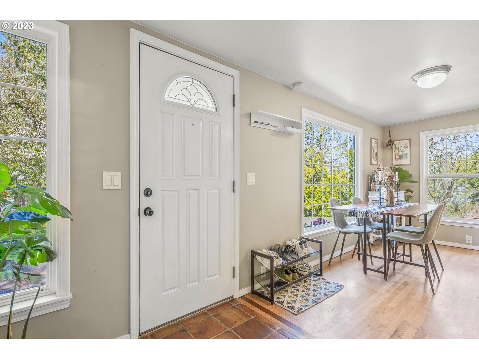 4052 Southwest Huber Street Portland, OR 97219 - Photo 12 of 48 a dining room with furniture and wooden floor