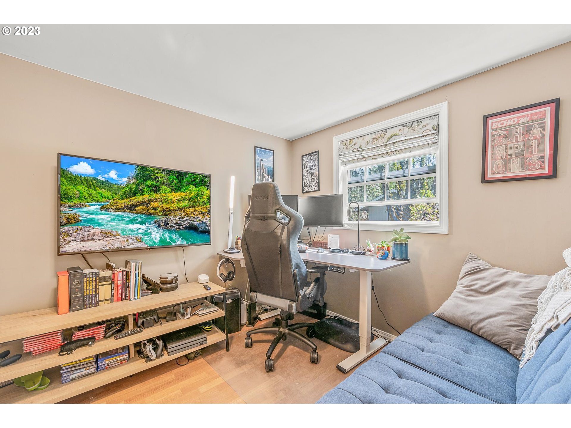 4052 Southwest Huber Street Portland, OR 97219 - Photo 18 of 48 a living room with furniture and a flat screen tv