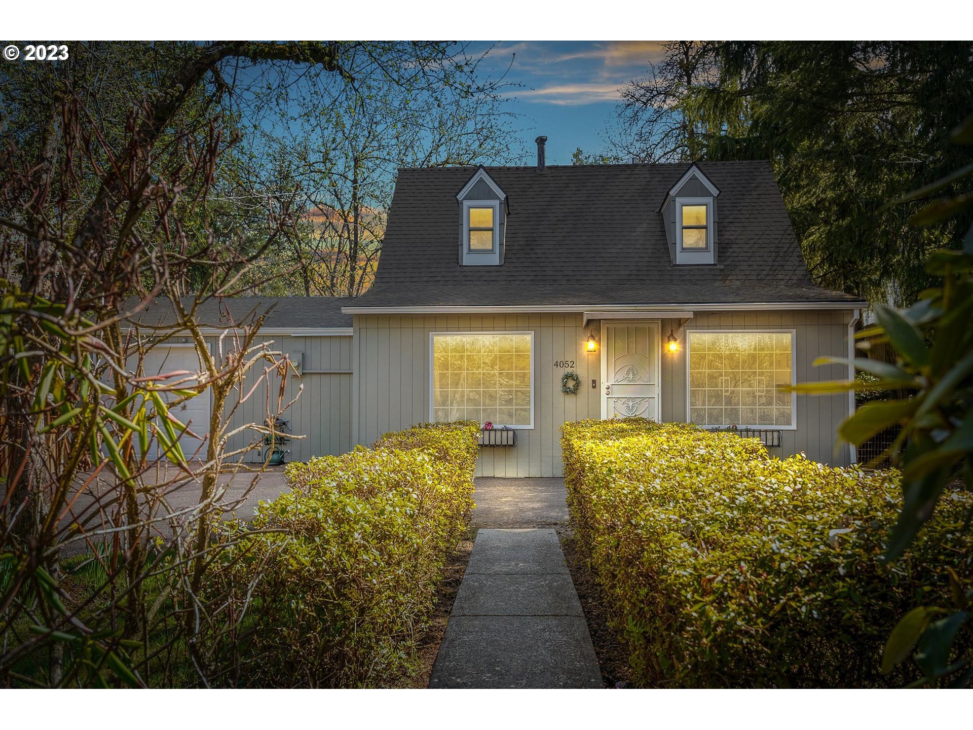 4052 Southwest Huber Street Portland, OR 97219 - Photo 2 of 48 a front view of house with yard