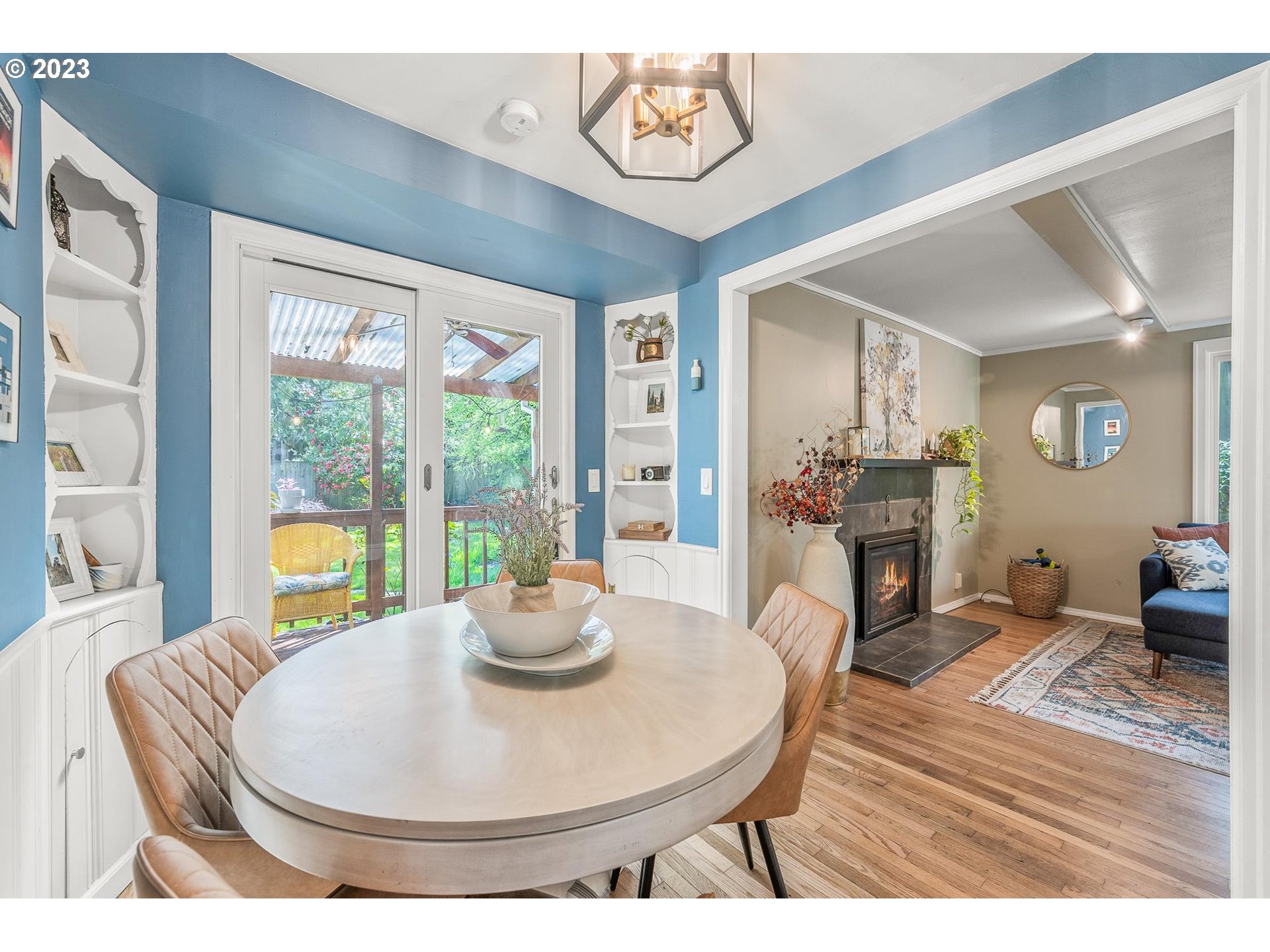 4052 Southwest Huber Street Portland, OR 97219 - Photo 21 of 48 a living room with furniture a fireplace and a large window