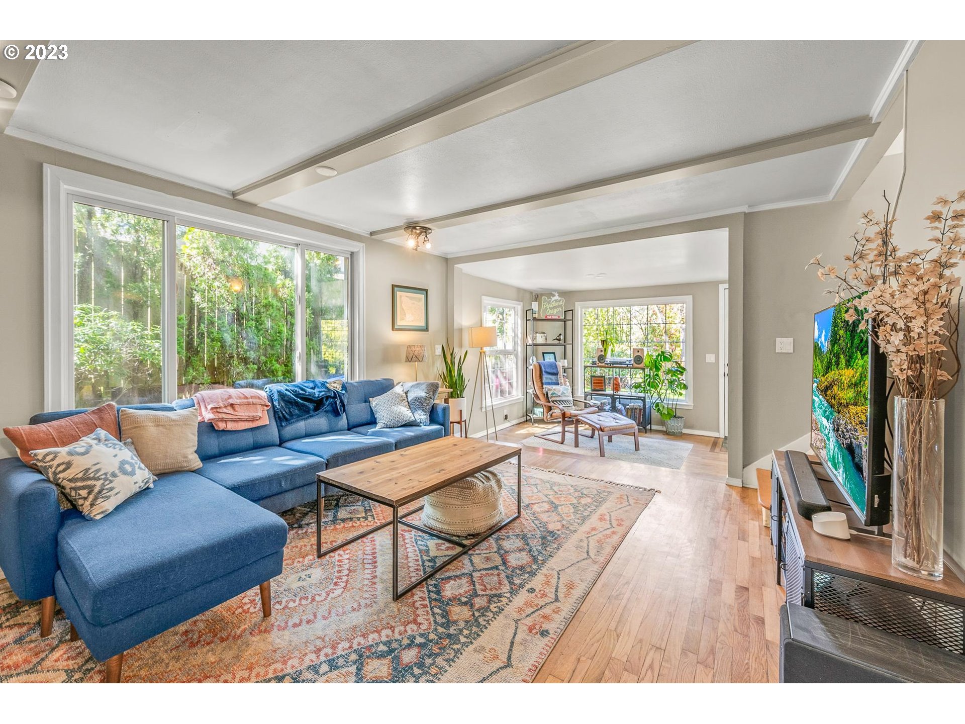 4052 Southwest Huber Street Portland, OR 97219 - Photo 23 of 48 a living room with furniture and a wooden floor