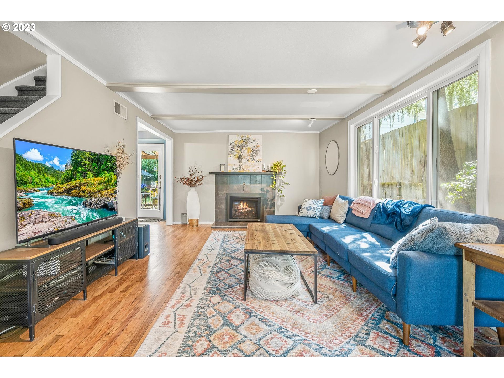 4052 Southwest Huber Street Portland, OR 97219 - Photo 25 of 48 a living room with furniture and a flat screen tv