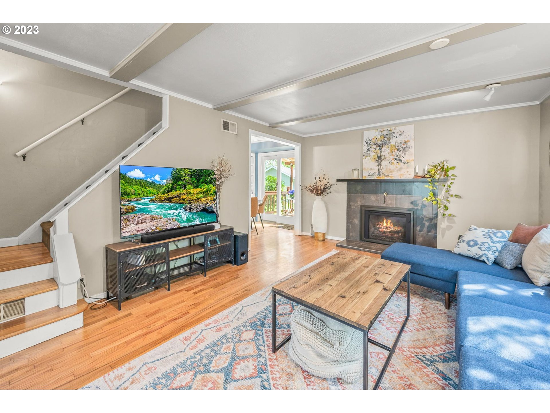4052 Southwest Huber Street Portland, OR 97219 - Photo 26 of 48 a living room with furniture and a fireplace