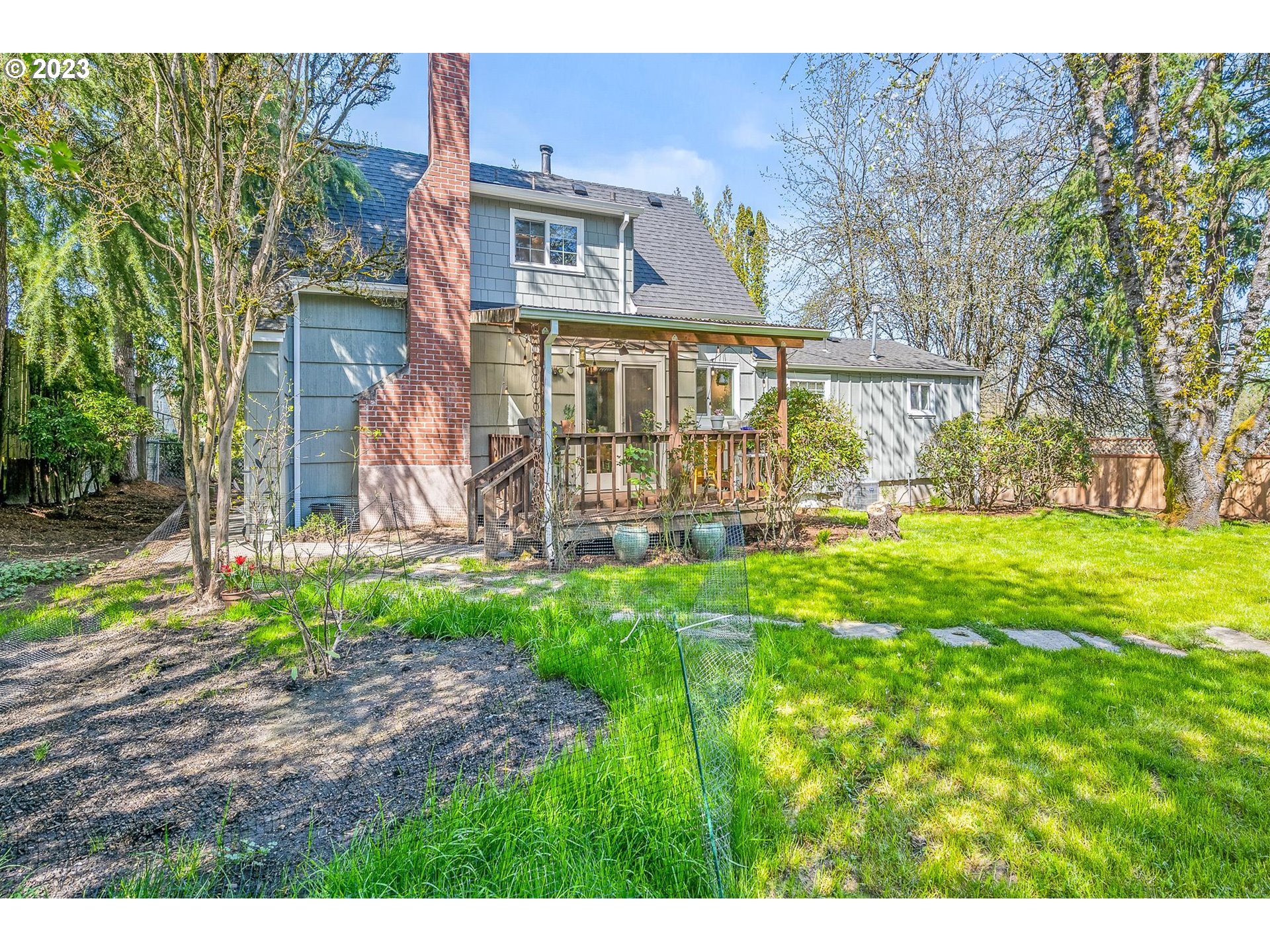 4052 Southwest Huber Street Portland, OR 97219 - Photo 33 of 48 front view of house with a yard