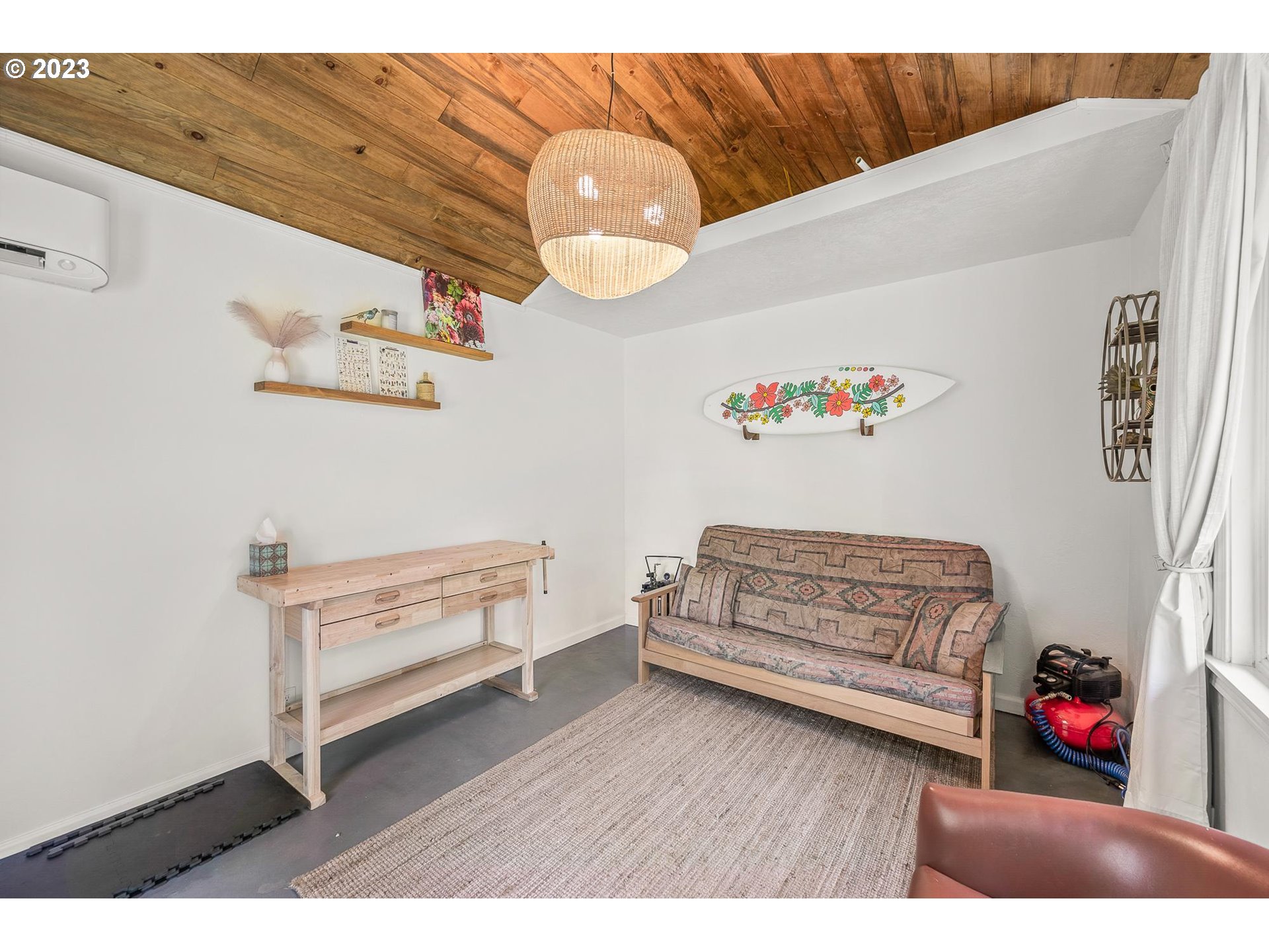 4052 Southwest Huber Street Portland, OR 97219 - Photo 38 of 48 a view of livingroom with furniture and wooden floor