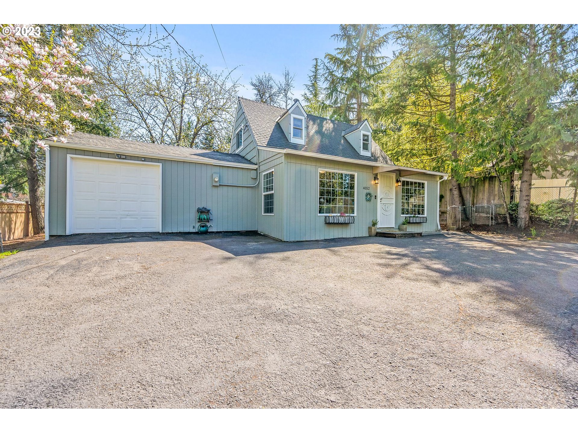 4052 Southwest Huber Street Portland, OR 97219 - Photo 41 of 48 front view of a house with a dry yard