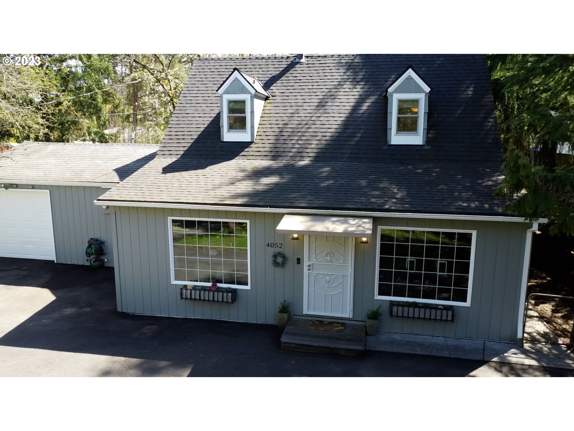4052 Southwest Huber Street Portland, OR 97219 - Photo 8 of 48 a black and white photo of a house