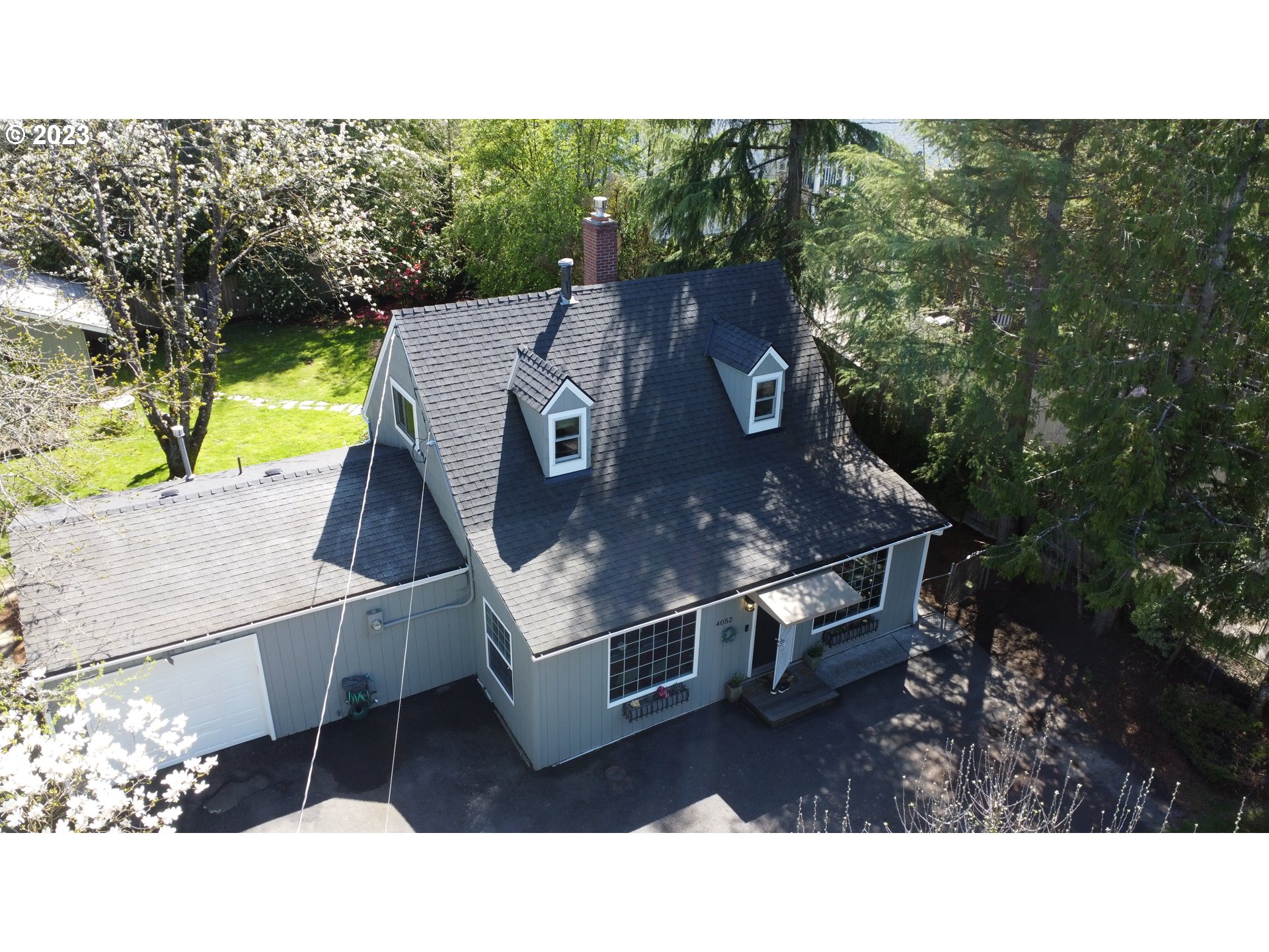 4052 Southwest Huber Street Portland, OR 97219 - Photo 9 of 48 a aerial view of a house with a yard