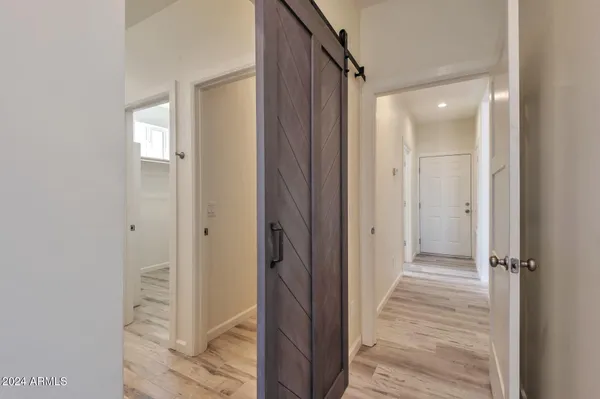 a view of a bathroom from a hallway