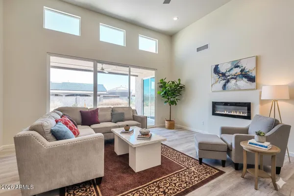 a living room with furniture and a large window