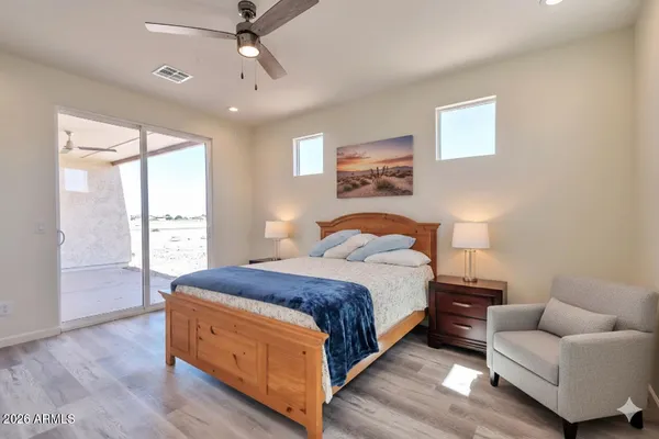 a bedroom with a bed and a couch