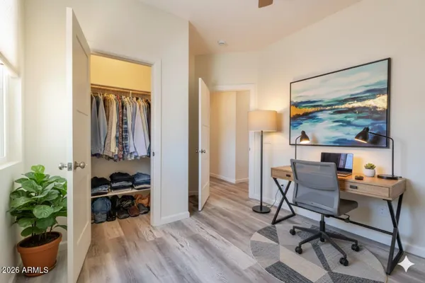 a workspace with furniture and a potted plant