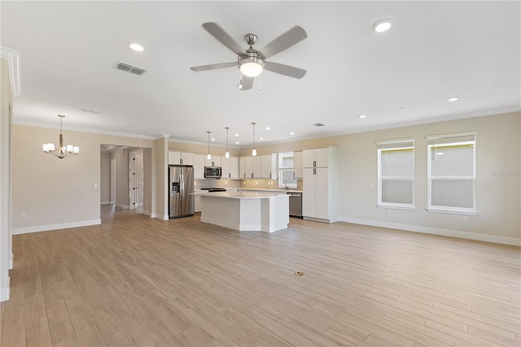 4473 Northwest 53rd Avenue Road Ocala, FL 34482 - Photo 12 of 40 a view of an empty room with cabinet and a ceiling fan