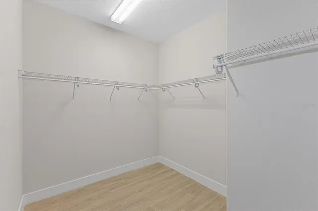 a bathroom with a sink a mirror and a shower