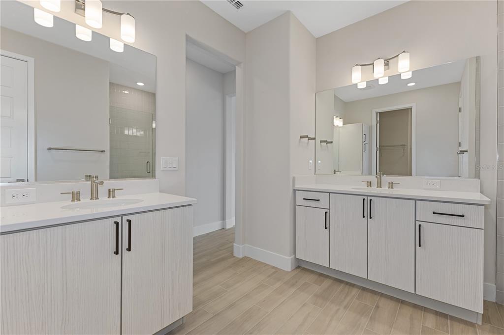 4473 Northwest 53rd Avenue Road Ocala, FL 34482 - Photo 31 of 40 a bathroom with a sink vanity and mirror