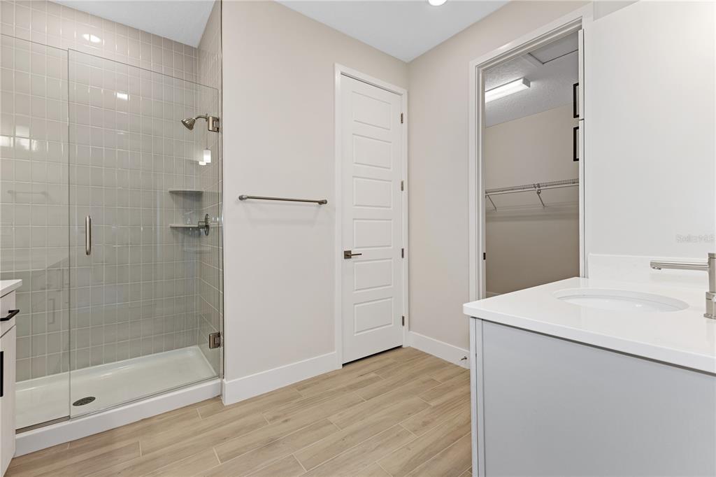 4473 Northwest 53rd Avenue Road Ocala, FL 34482 - Photo 32 of 40 a bathroom with a sink a shower and a mirror