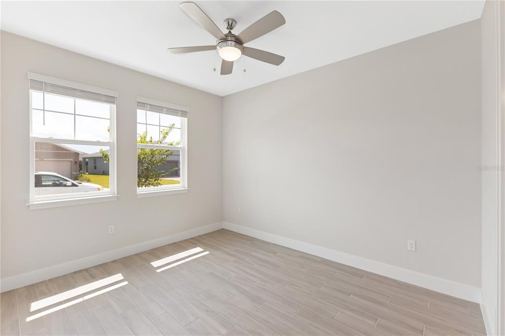 4473 Northwest 53rd Avenue Road Ocala, FL 34482 - Photo 33 of 40 an empty room with a window and a fan