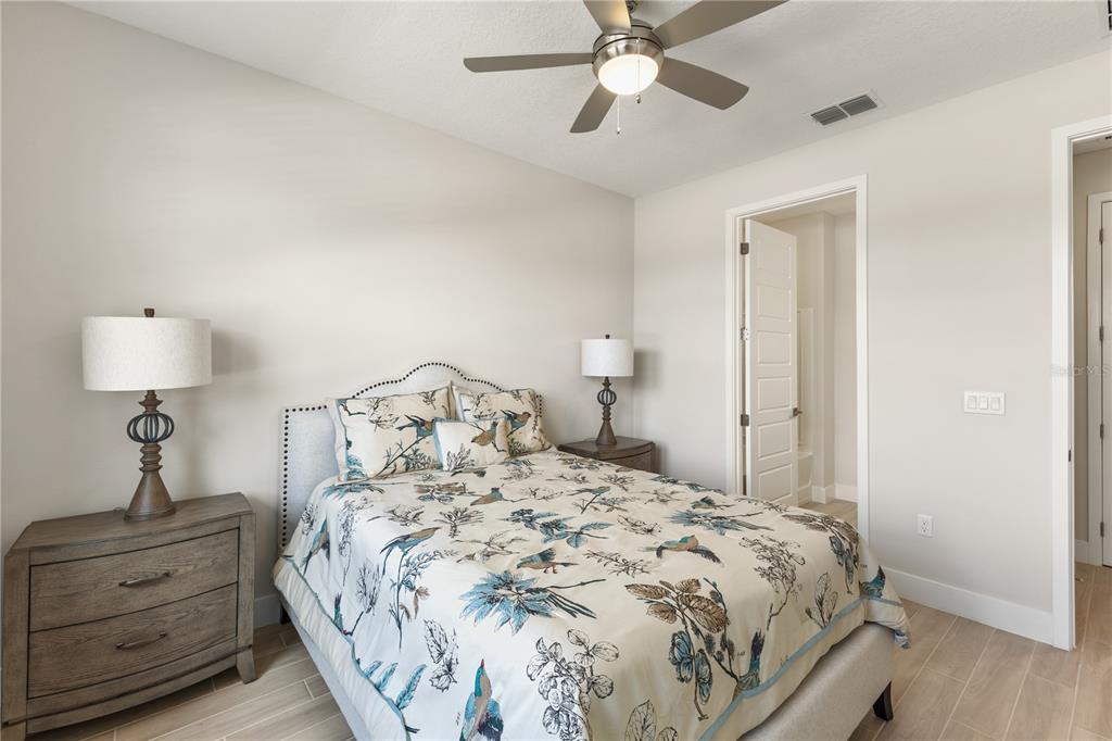 4473 Northwest 53rd Avenue Road Ocala, FL 34482 - Photo 36 of 40 a bedroom with a bed and a chandelier
