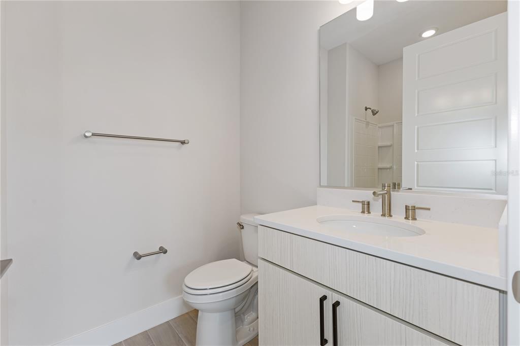 4473 Northwest 53rd Avenue Road Ocala, FL 34482 - Photo 37 of 40 a bathroom with a toilet sink and mirror